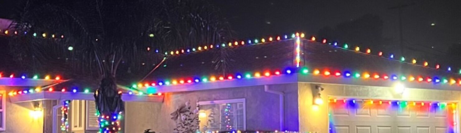 Holiday light installation in Elk Grove, CA: multicolor c9 garage eave run